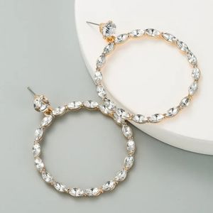 Clear Marquise hoop earrings.